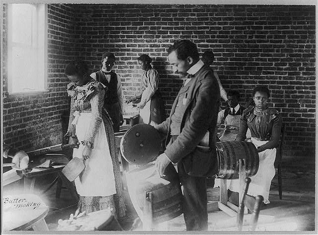 Students learn how to churn butter in an 1897 class at A&T.