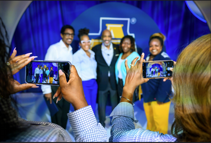 alumni cheering on game day