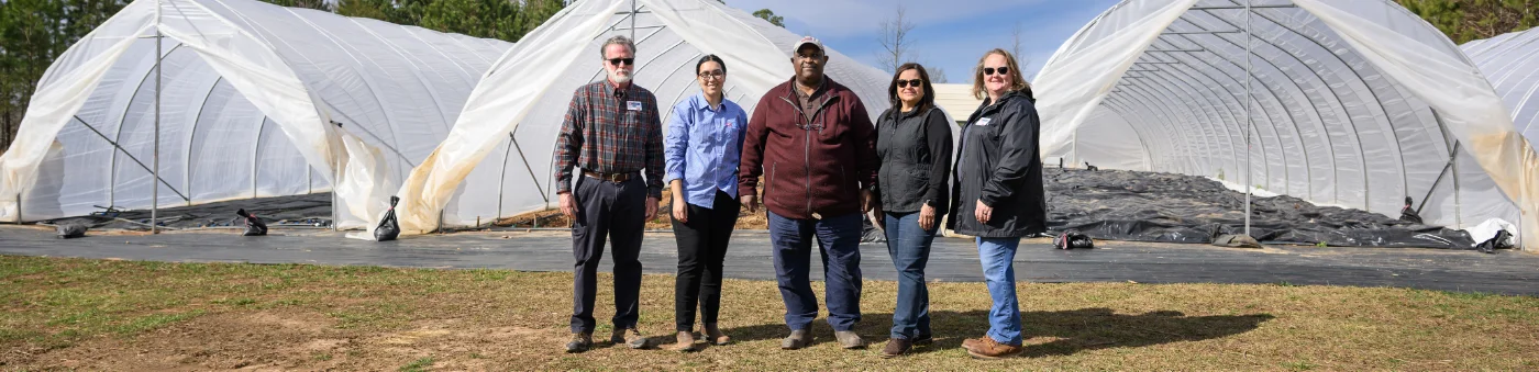 Excited N.C. A&T graduates in caps and gowns celebrate at commencement, holding diplomas and taking selfies. The graphic highlights 14,311 students enrolled in Fall 2024, 95 degree programs, and 2,274 bachelor degrees awarded in 2023–2024.