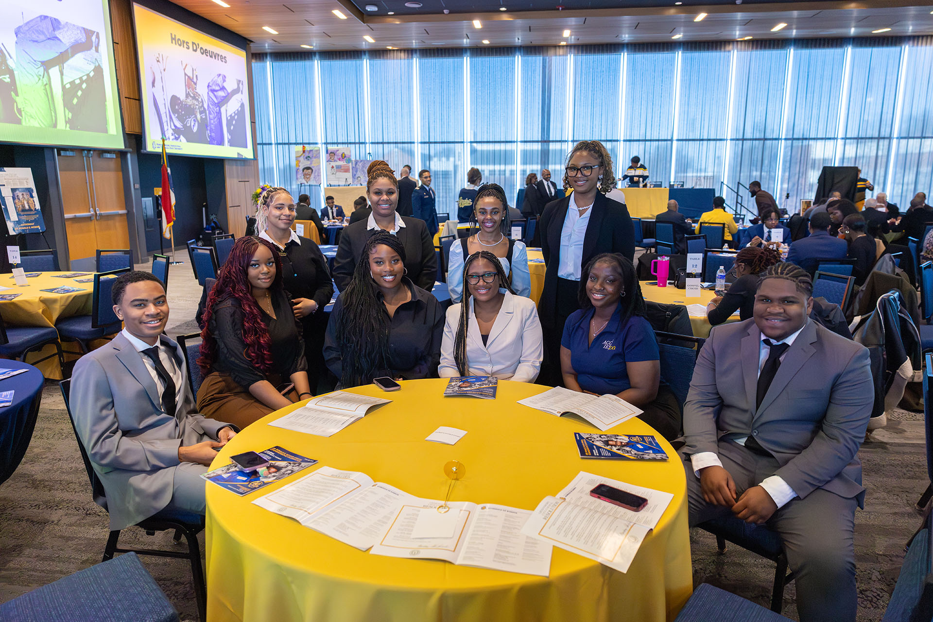 Ten TRiO McNair Scholars surround a table at the 40th annual Ronald E. McNair celebration