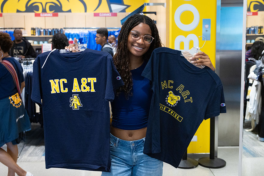 female student with two tshirts
