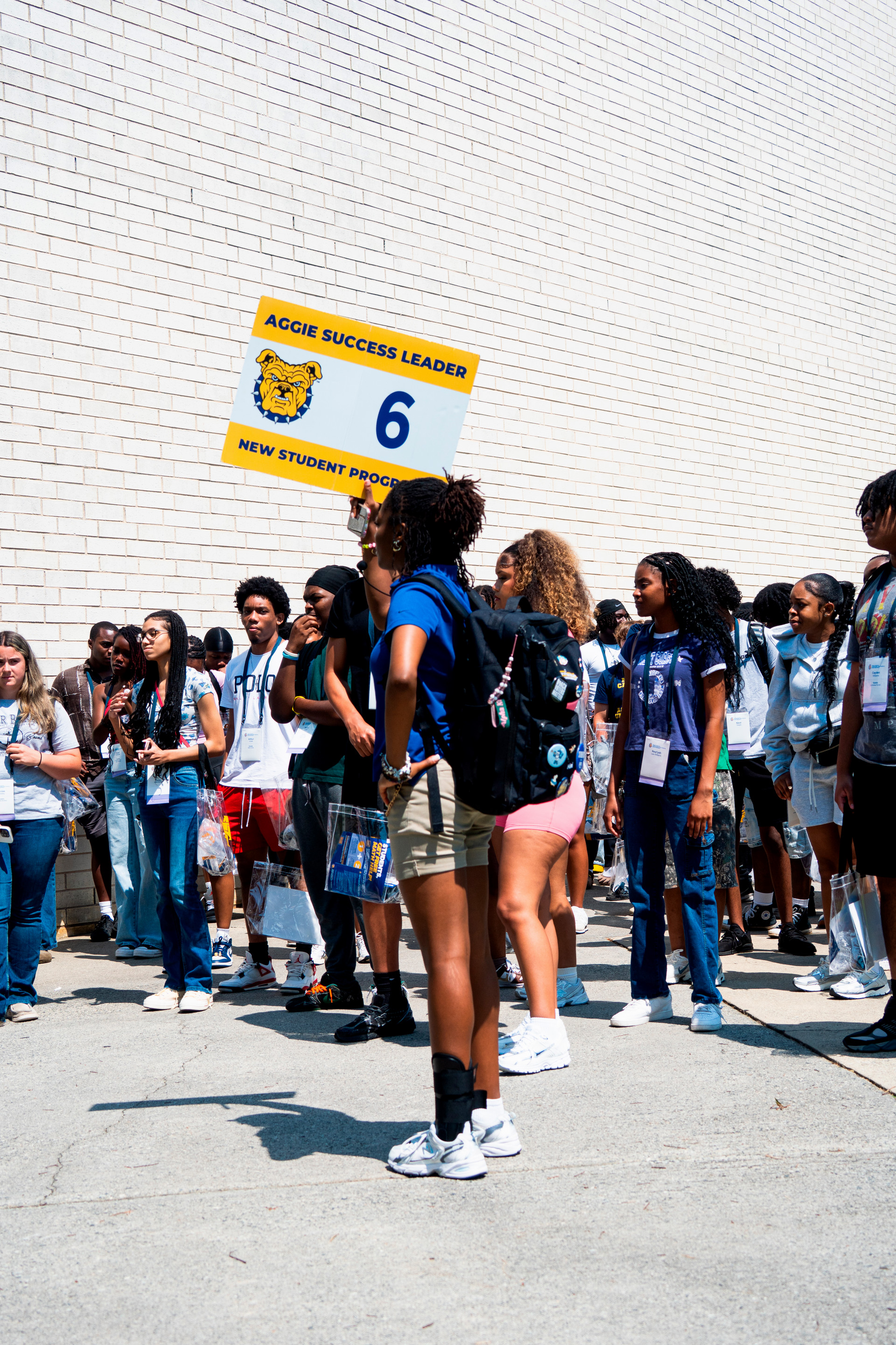 ASL holding a sign during the tour